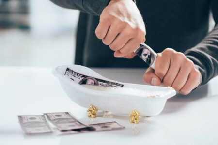 Money laundering and wash trading in the NFT markets